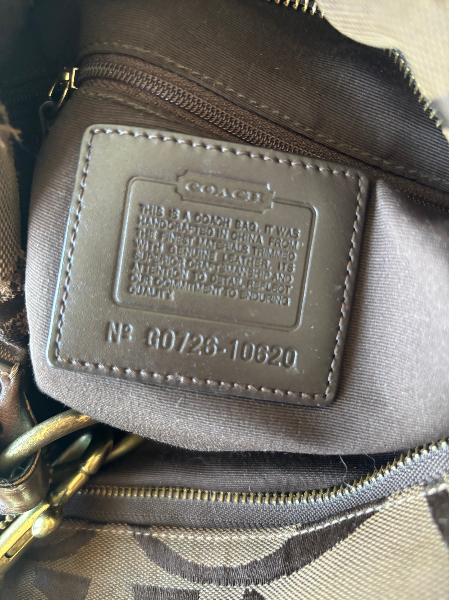 Brown large coach Carly