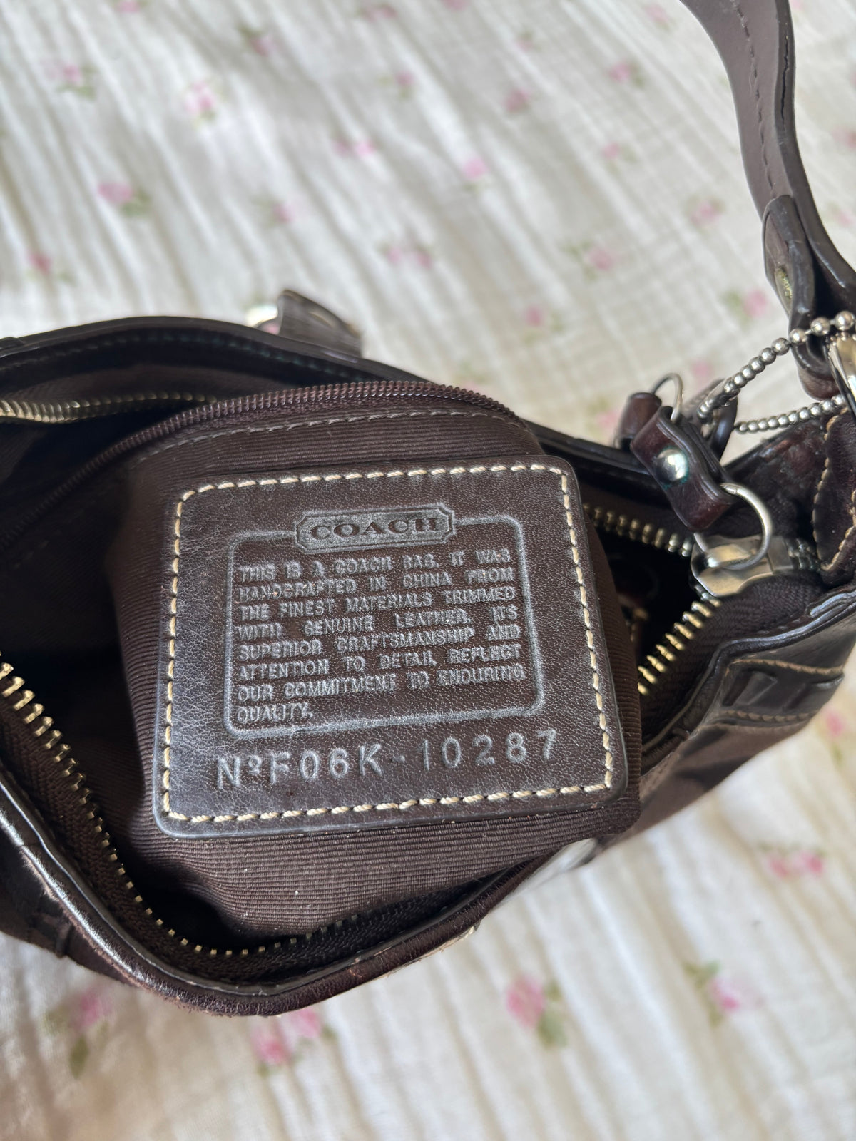 Brown mongram coach mini bag