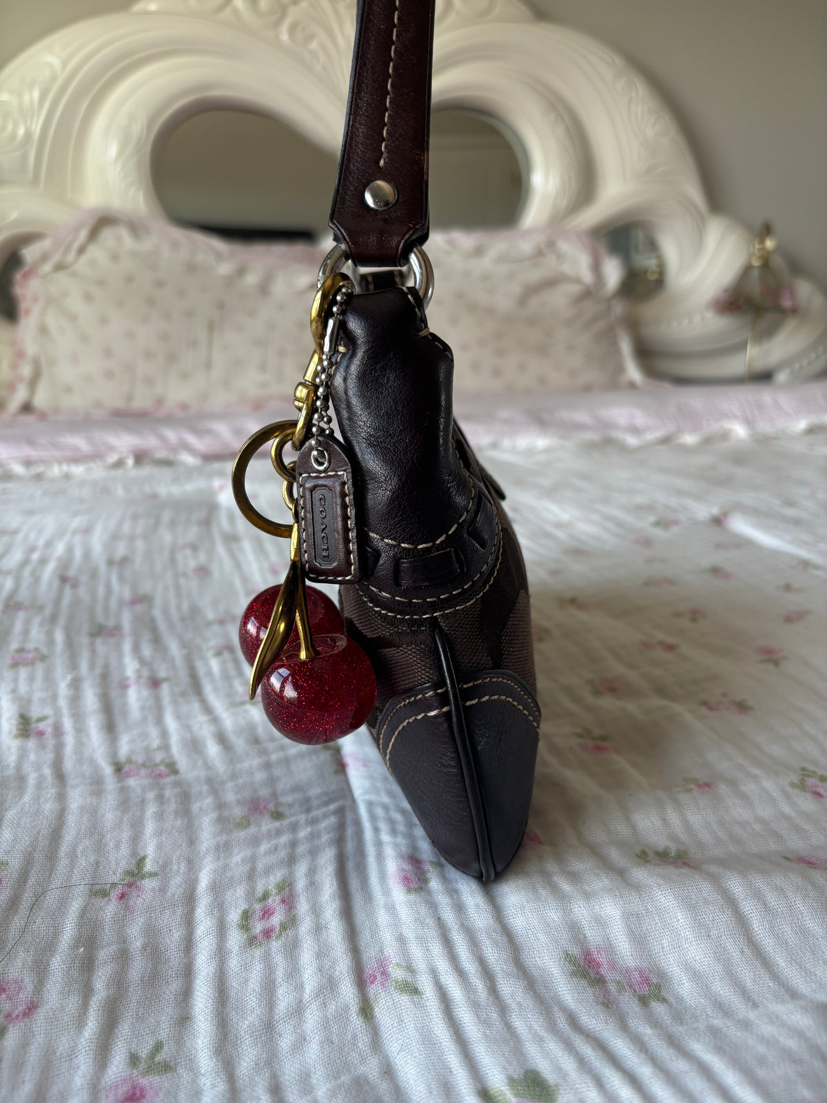 Brown mongram coach mini bag