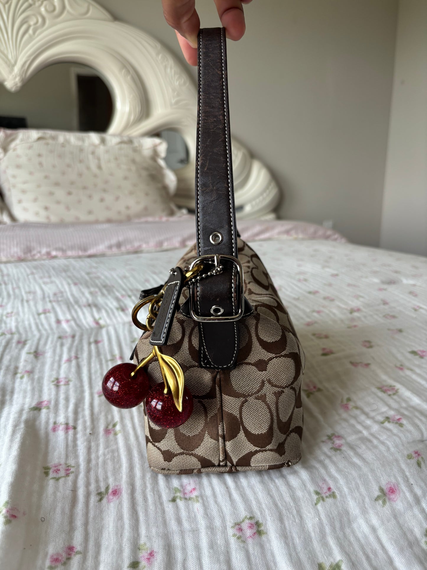 Brown mongram coach baggutte shoulder bag