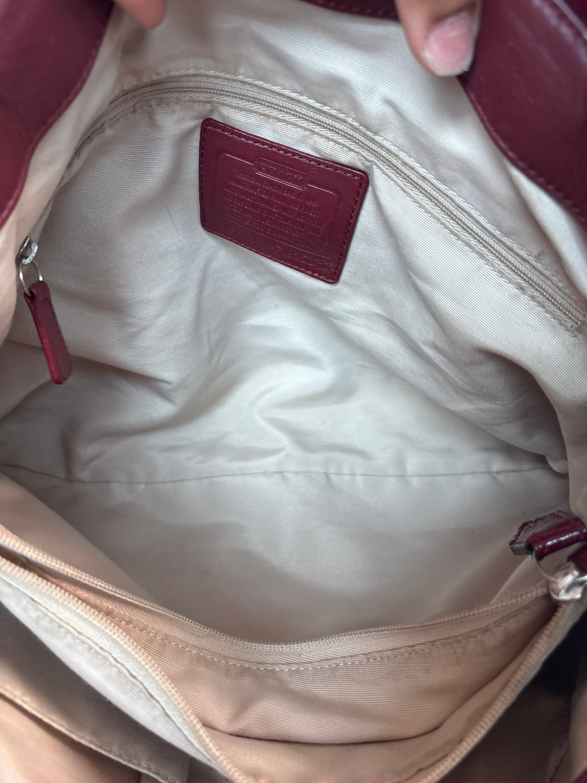 Red and brown mongram coach tote bag