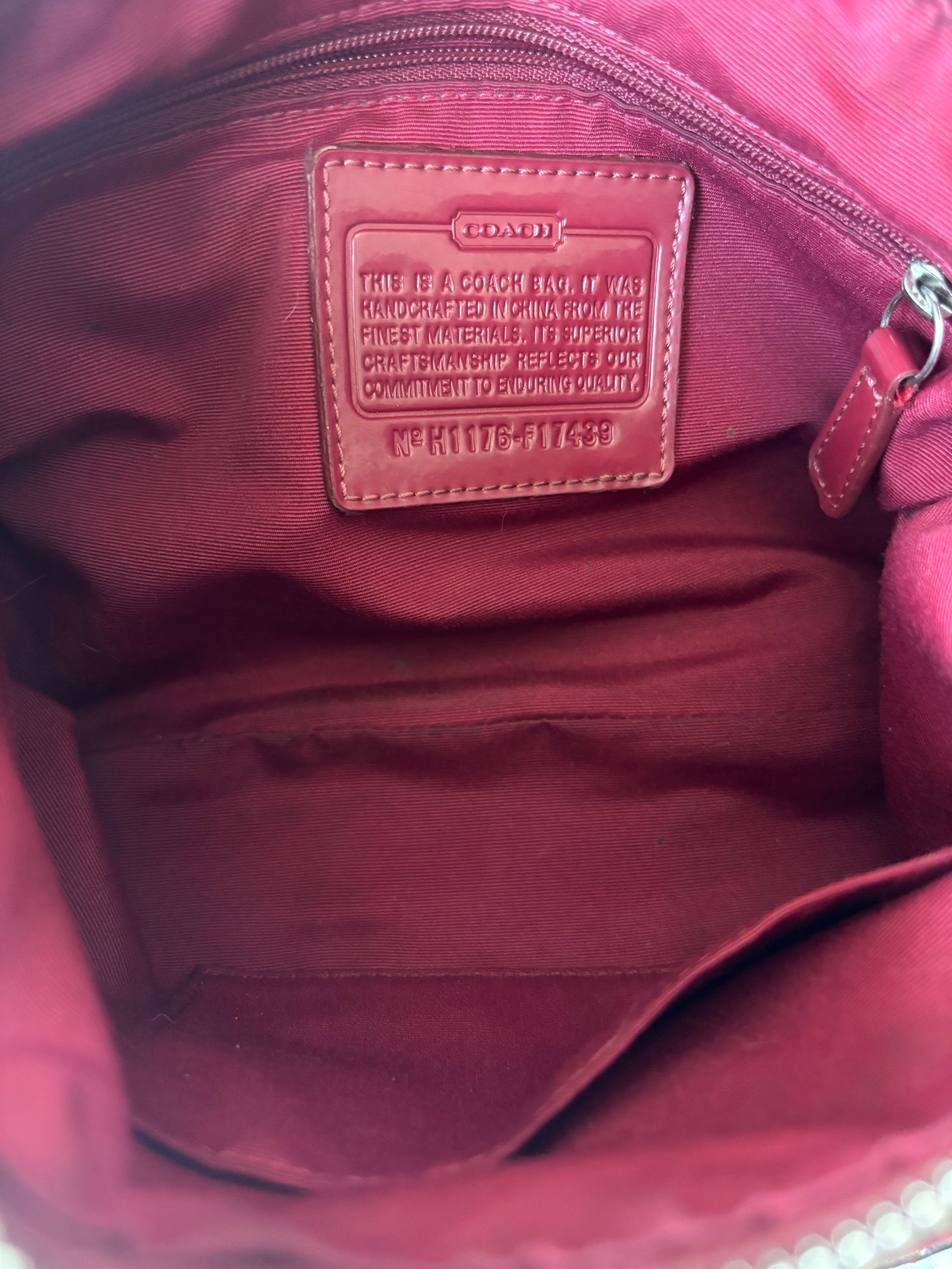 Red mongram coach shoulder bag