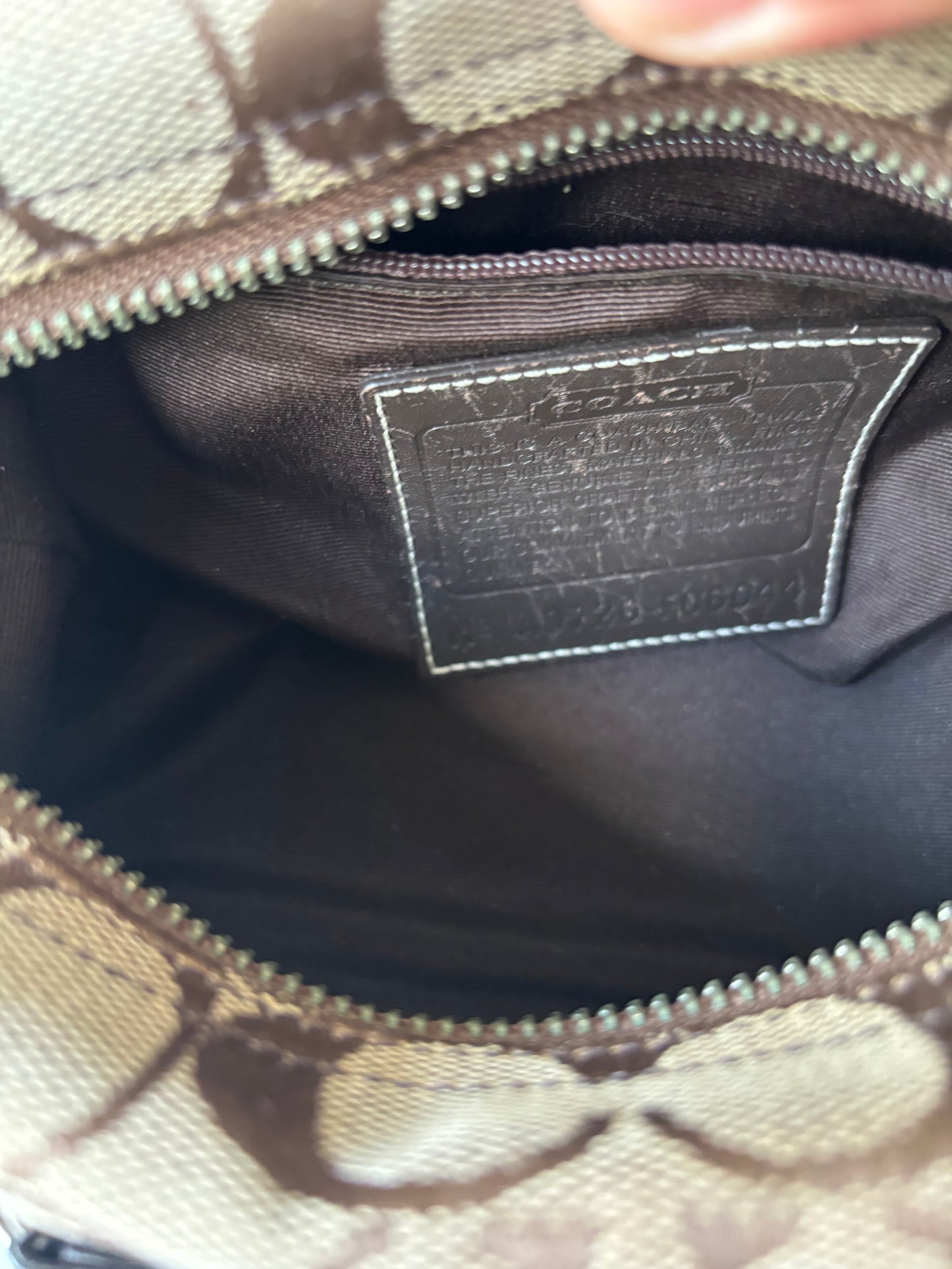 Brown mongram coach baggutte shoulder bag