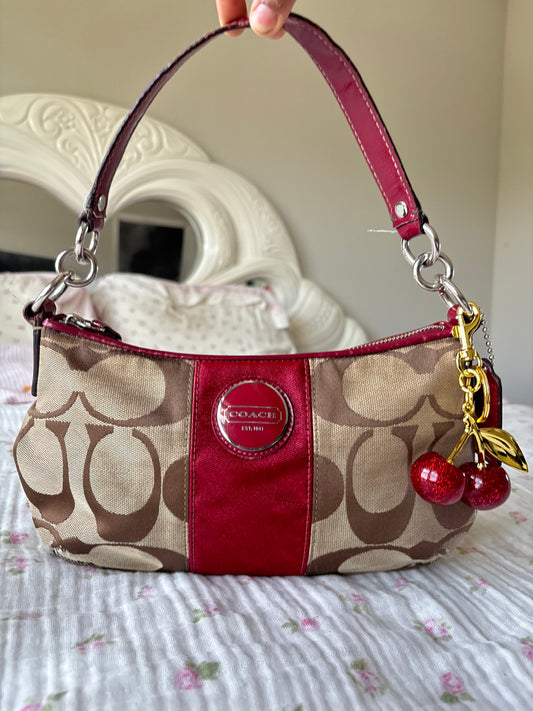 Red mongram coach shoulder bag