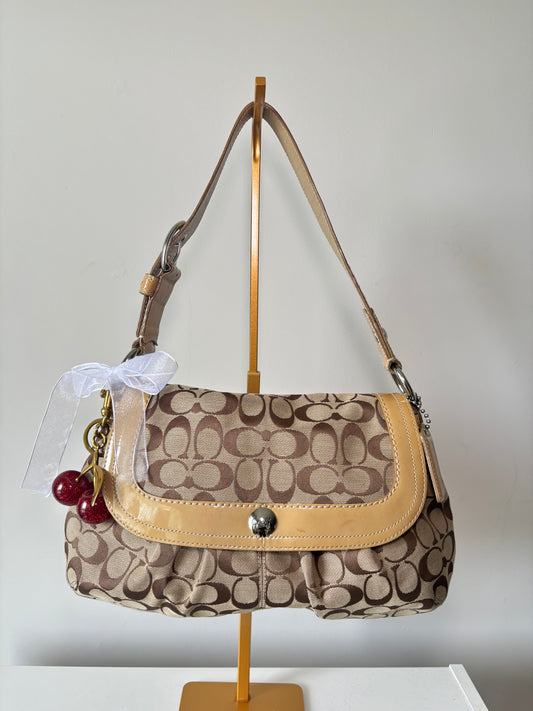Brown mongram coach flap shoulder bag