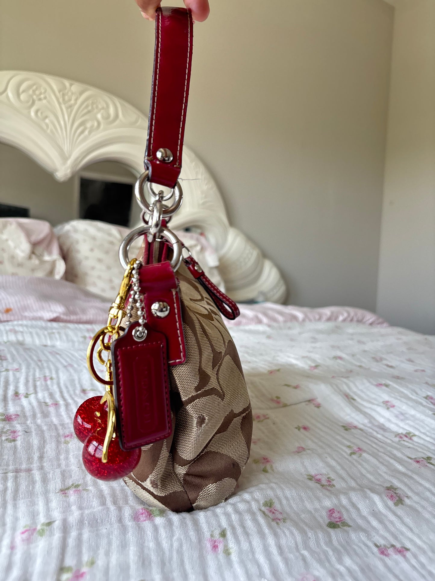 Red mongram coach shoulder bag
