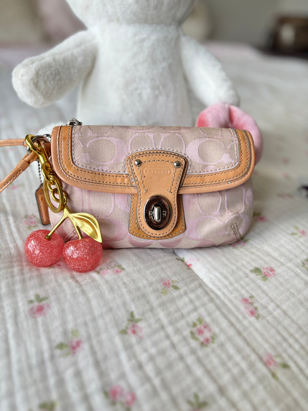 Pink mongram coach wristlet