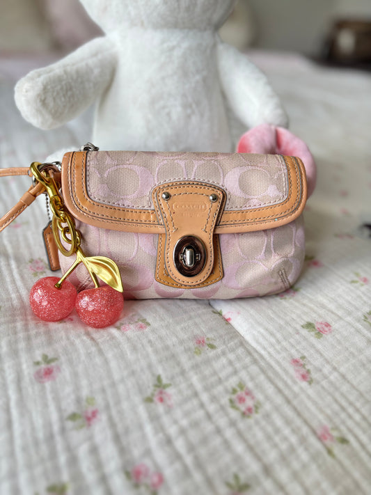 Pink mongram coach wristlet