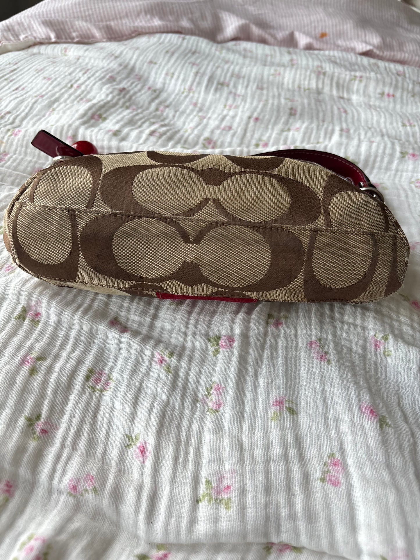 Red mongram coach shoulder bag