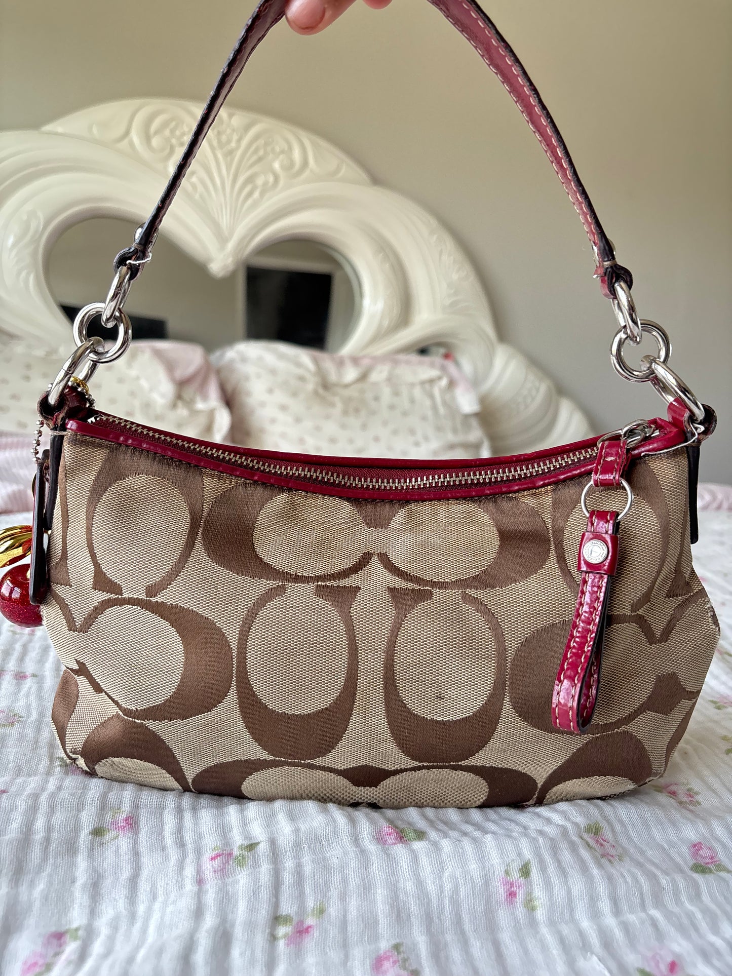 Red mongram coach shoulder bag