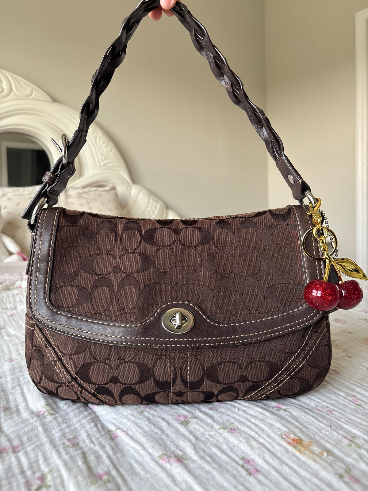 Brown mongram coach flap bag