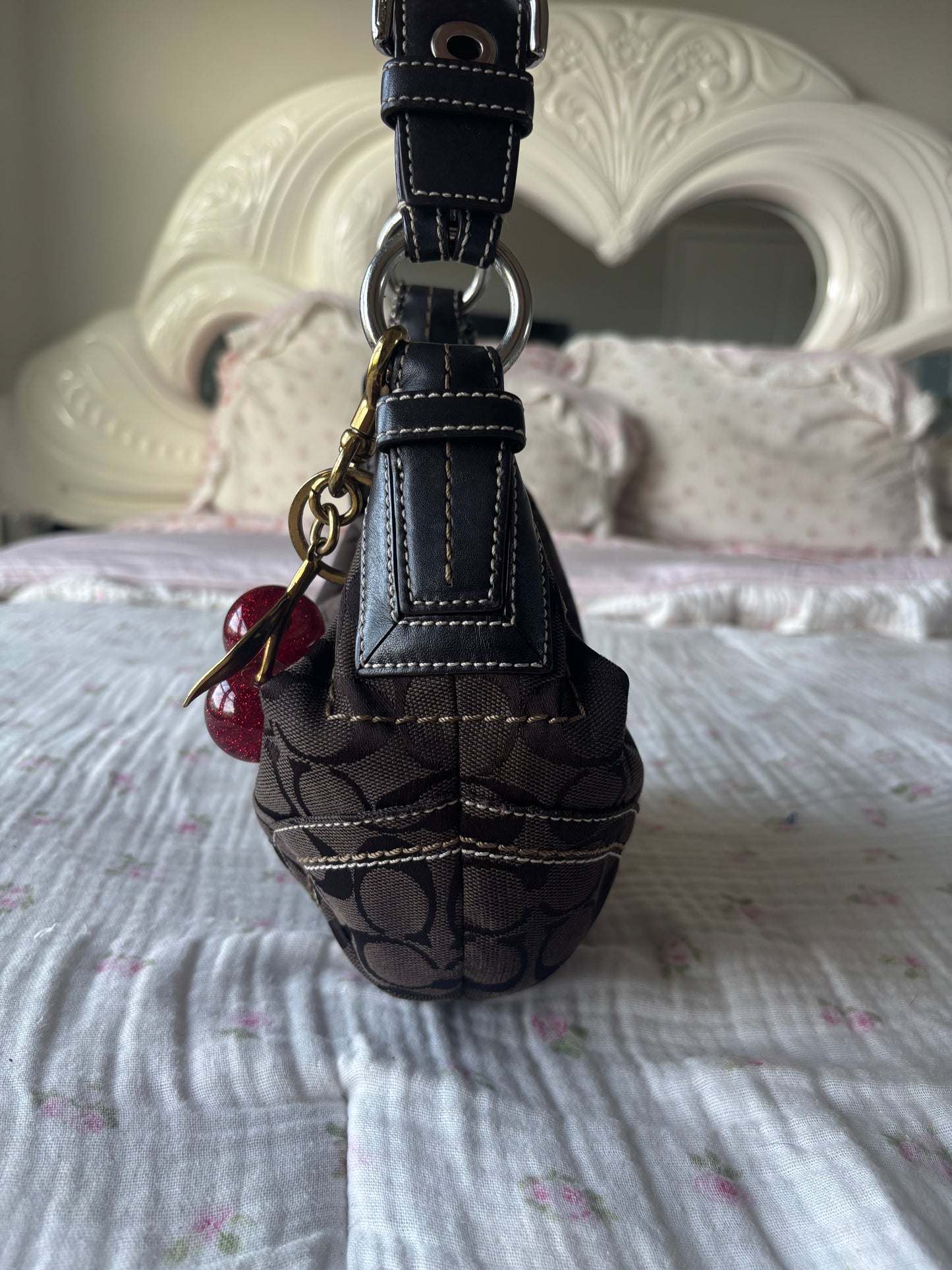 Brown mongram coach hobo bag