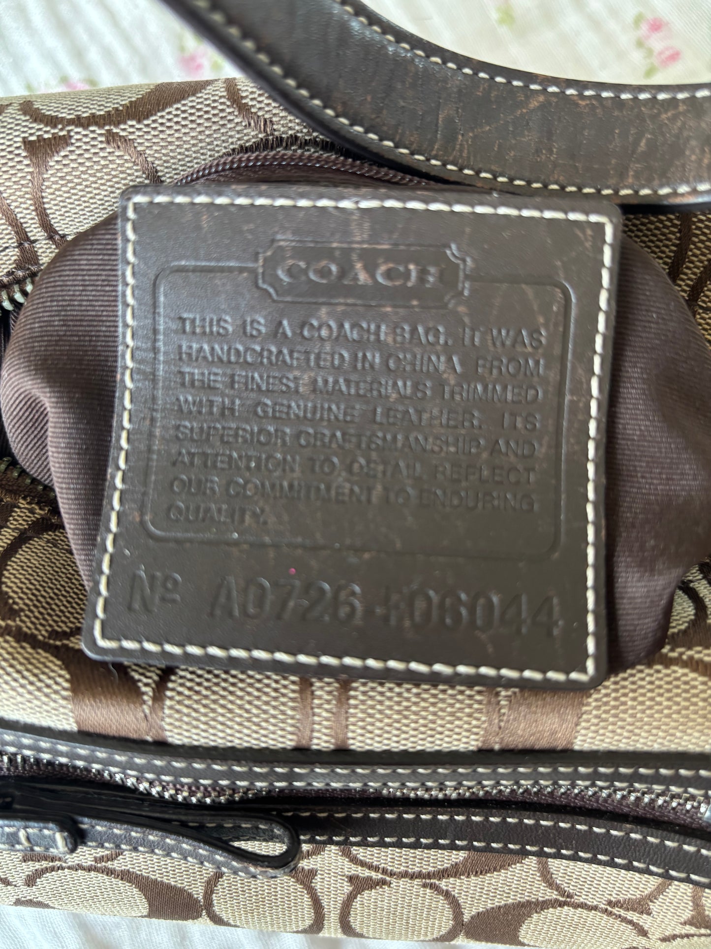 Brown mongram coach baggutte shoulder bag