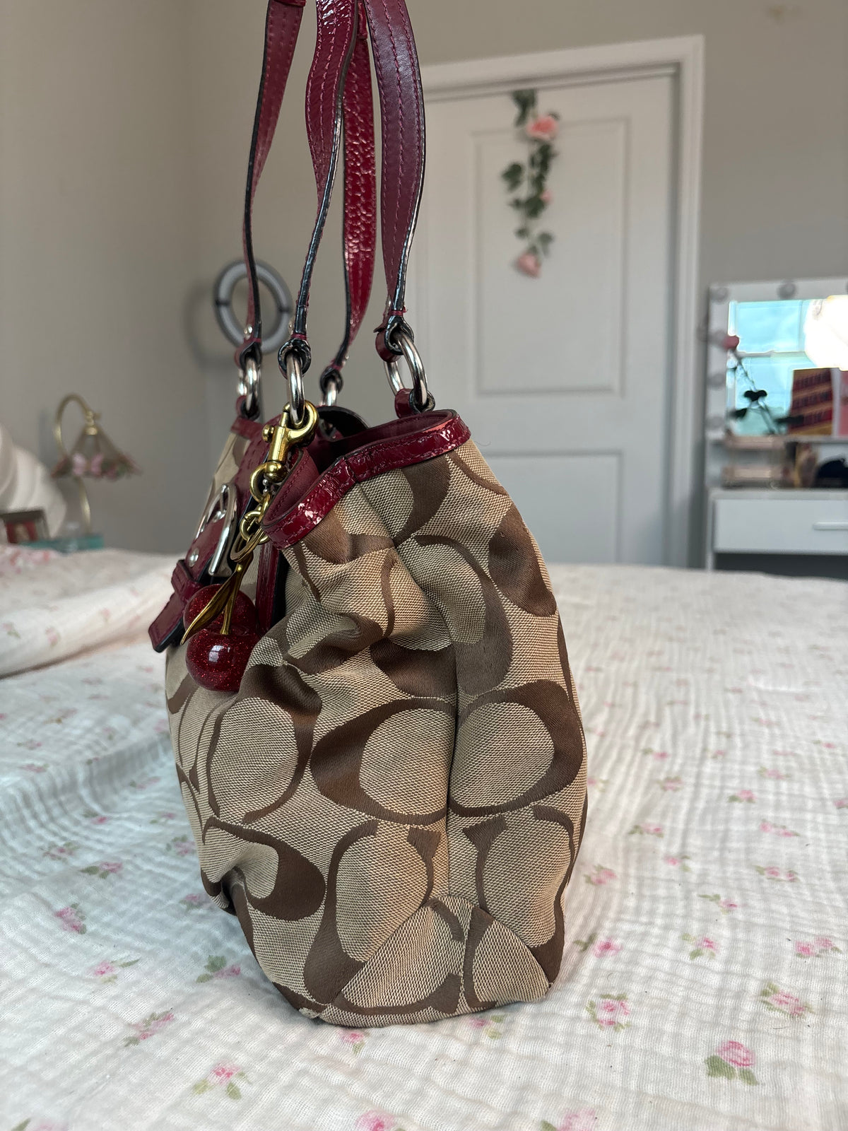 Red and brown mongram coach tote bag