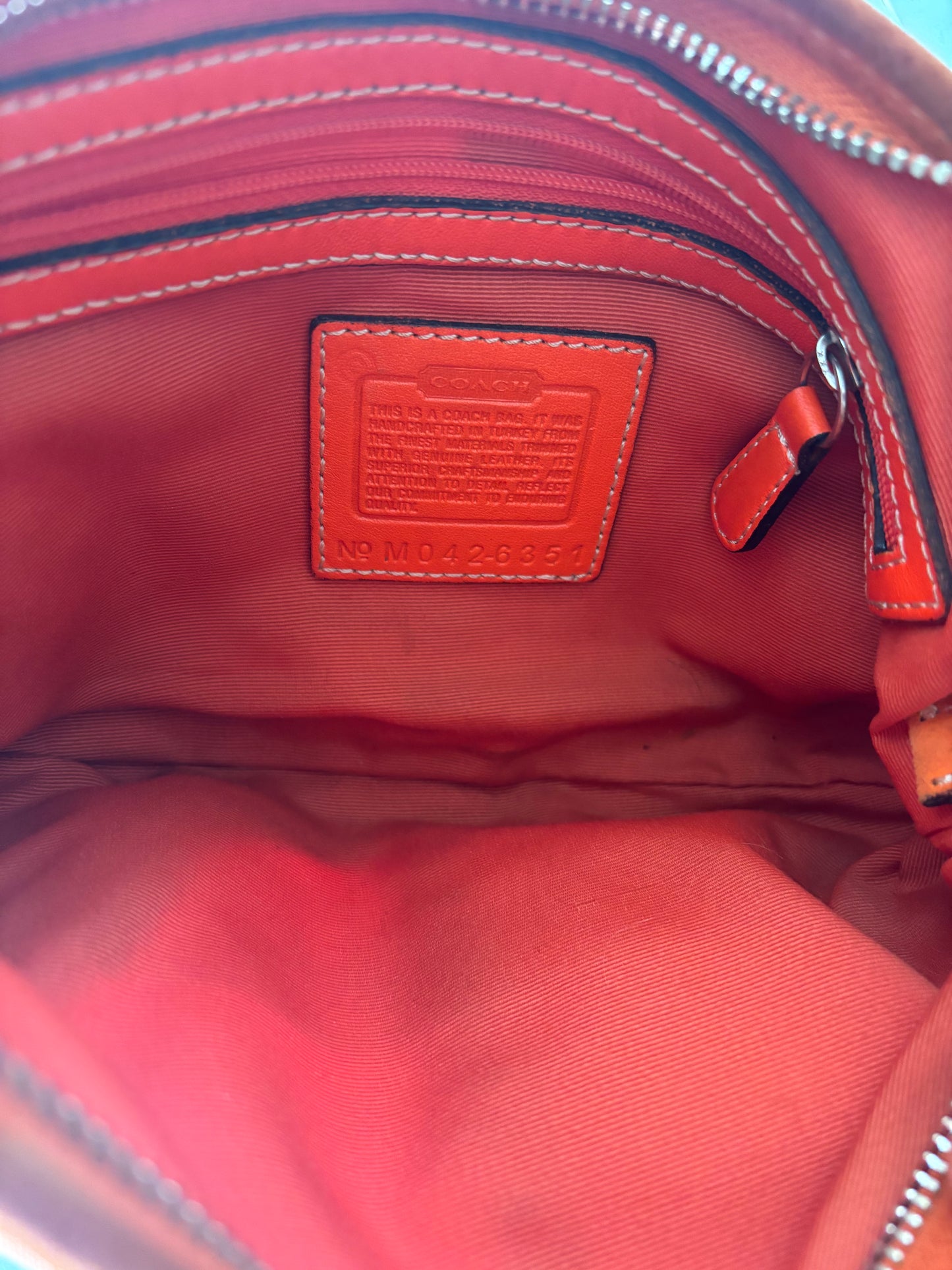 Orange coach mini hobo bag