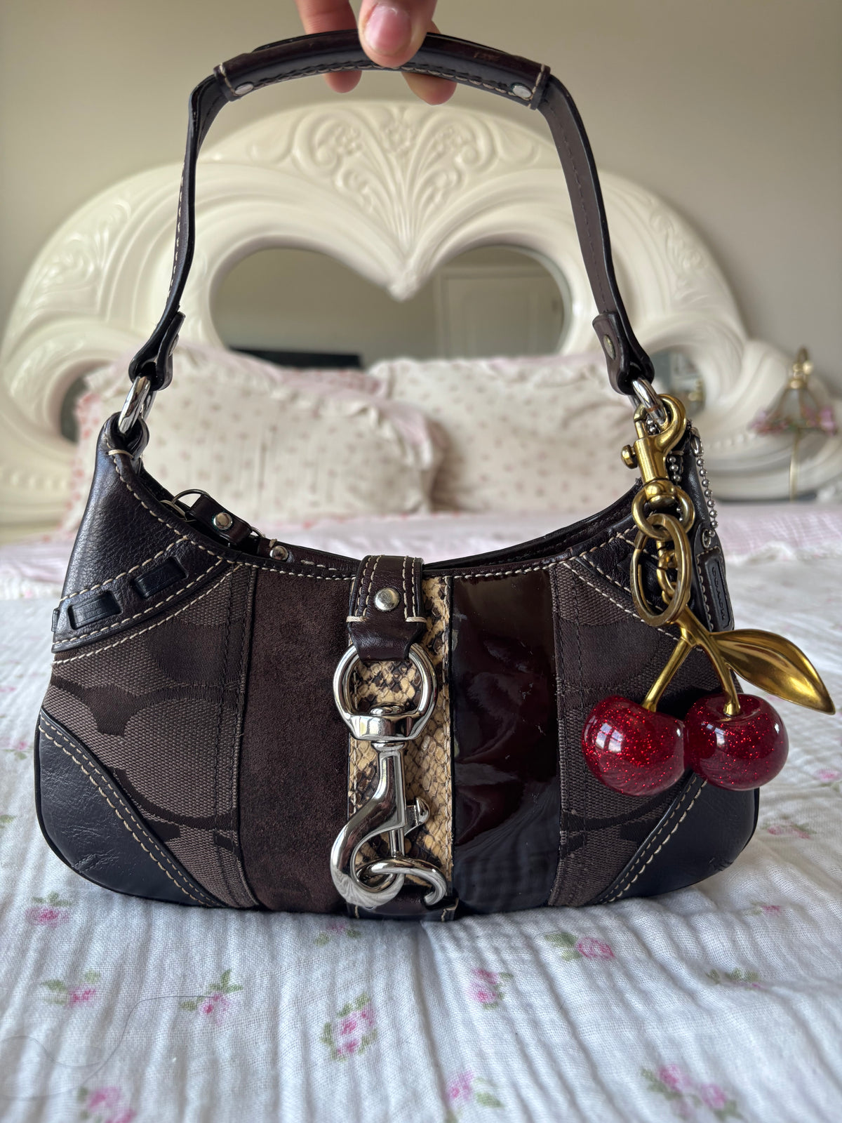 Brown mongram coach mini bag
