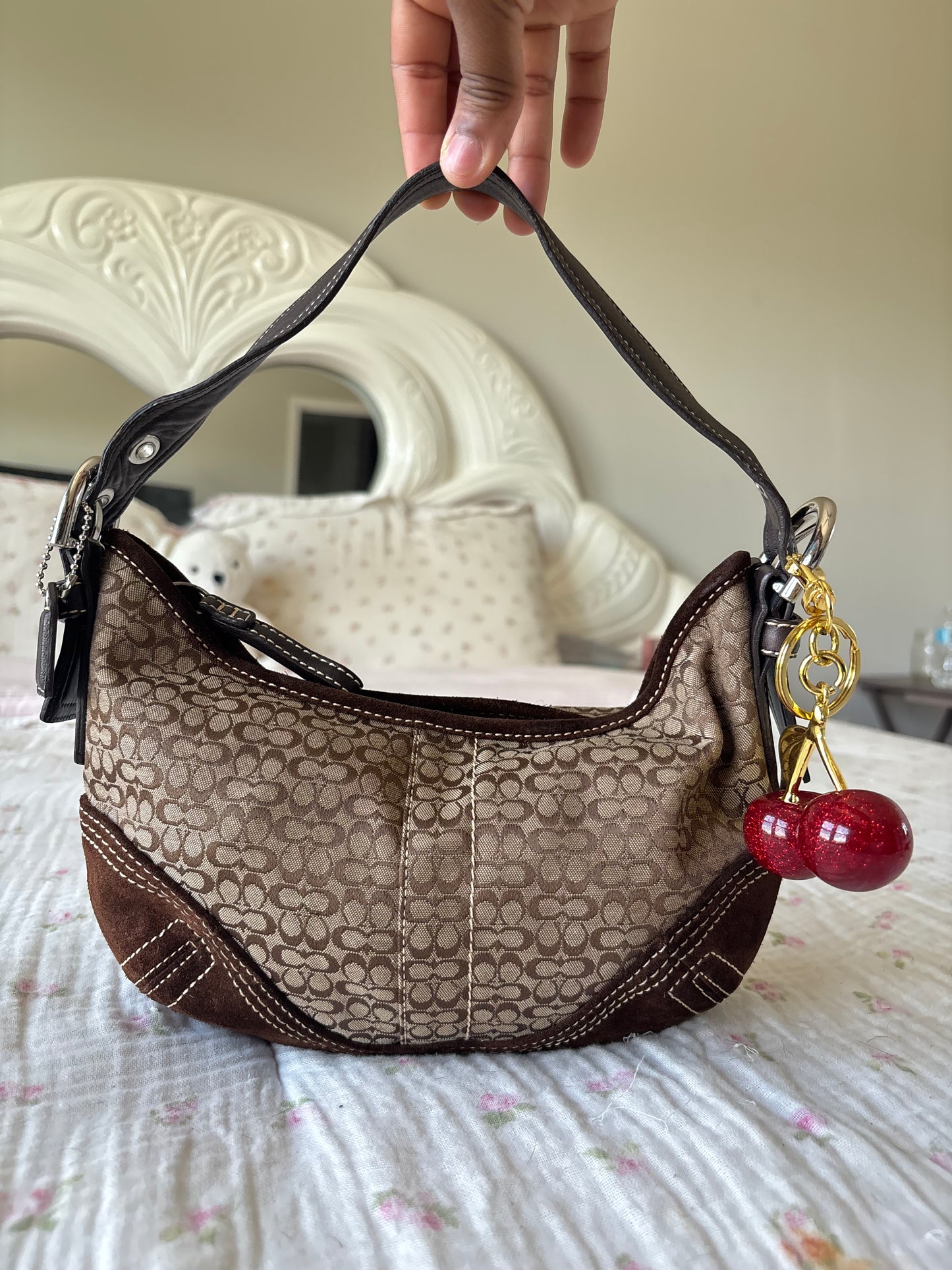 Brown mongram coach hobo bag