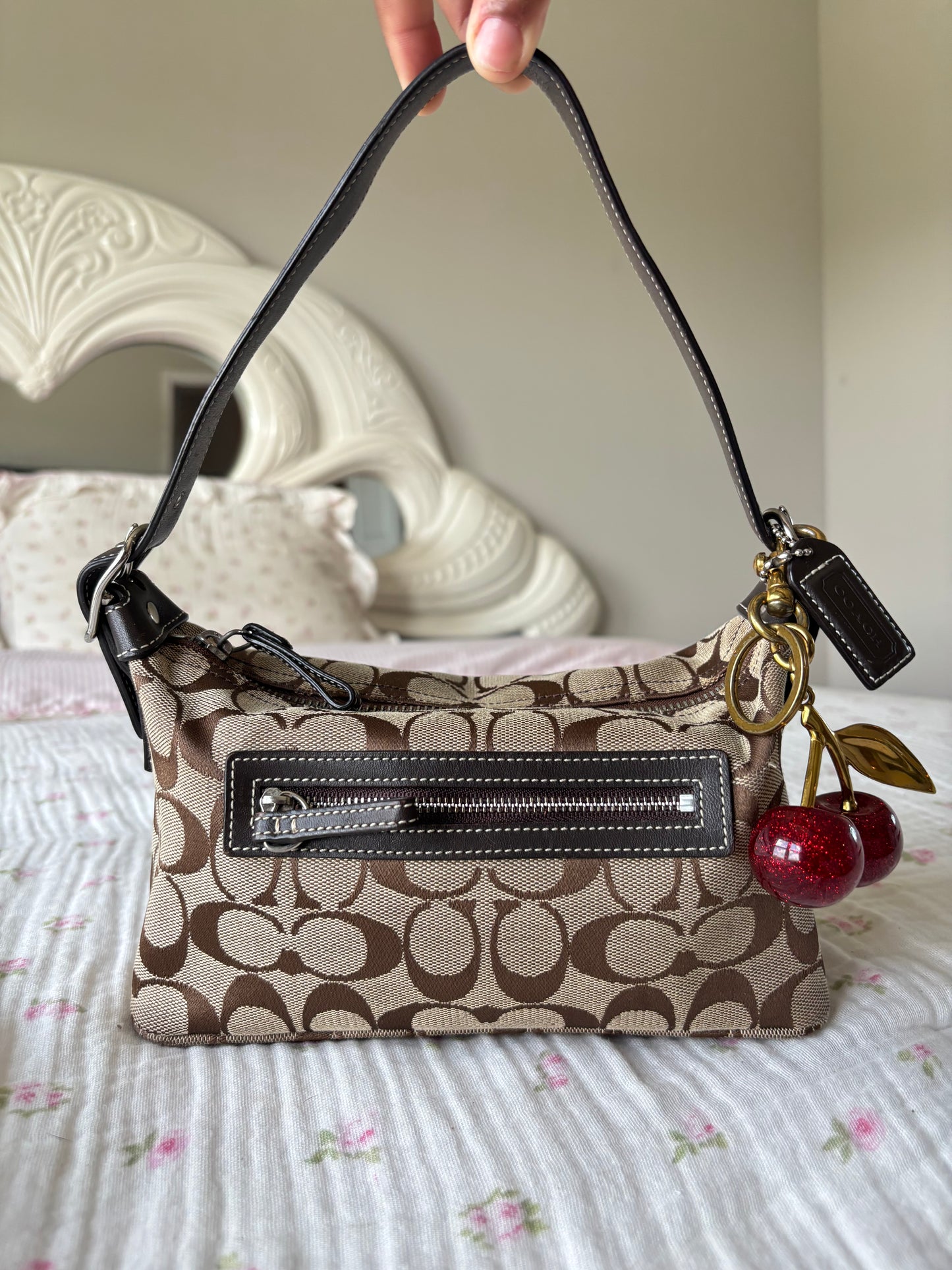 Brown mongram coach baggutte shoulder bag