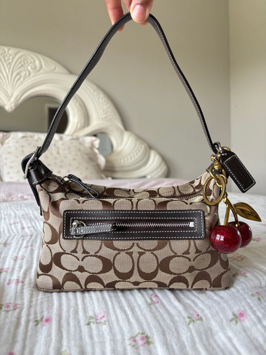 Brown mongram coach baggutte shoulder bag