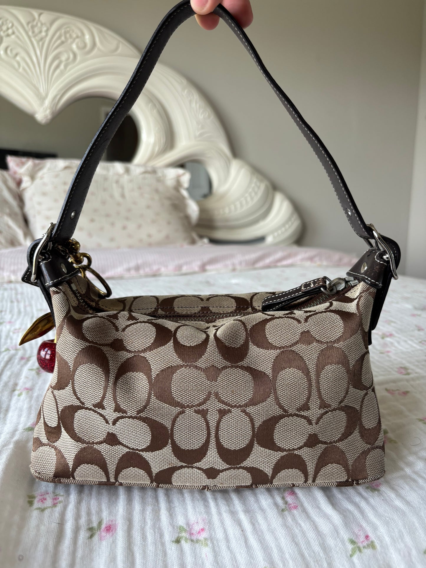Brown mongram coach baggutte shoulder bag