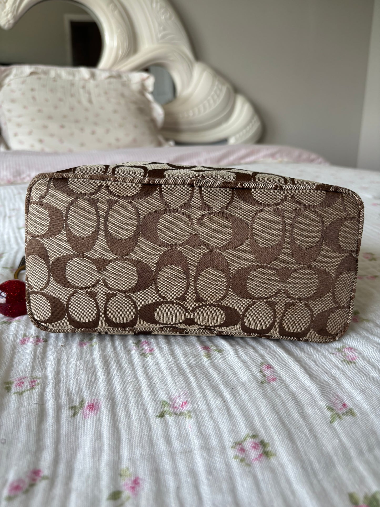 Brown mongram coach baggutte shoulder bag