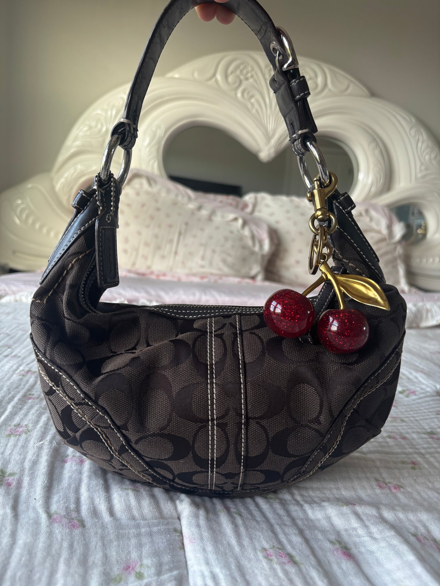 Brown mongram coach hobo bag