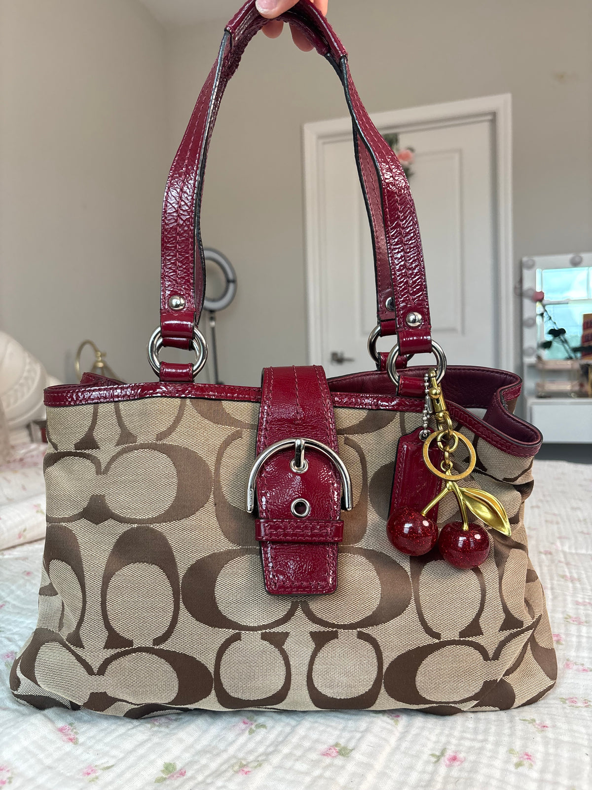 Red and brown mongram coach tote bag