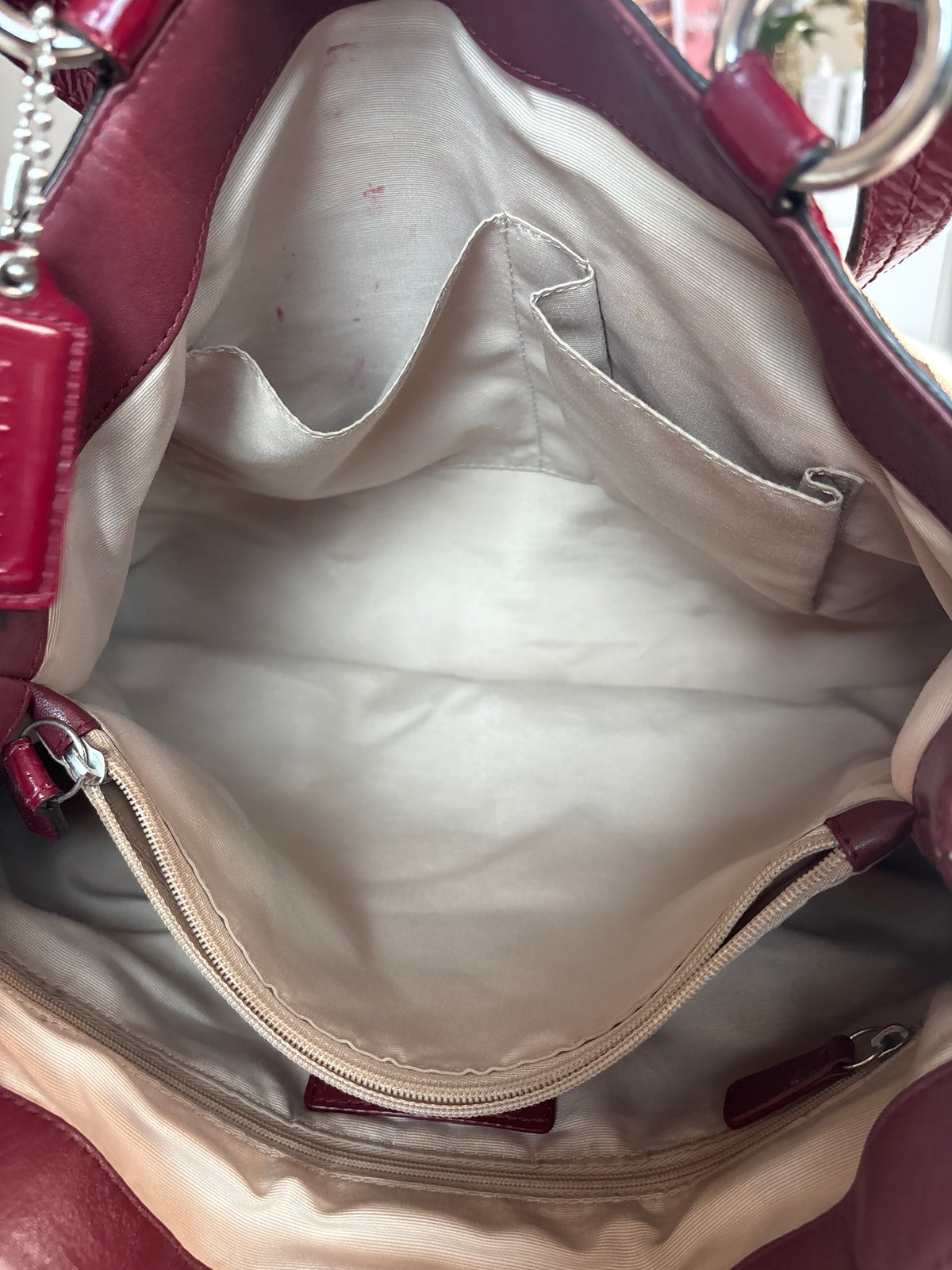 Red and brown mongram coach tote bag