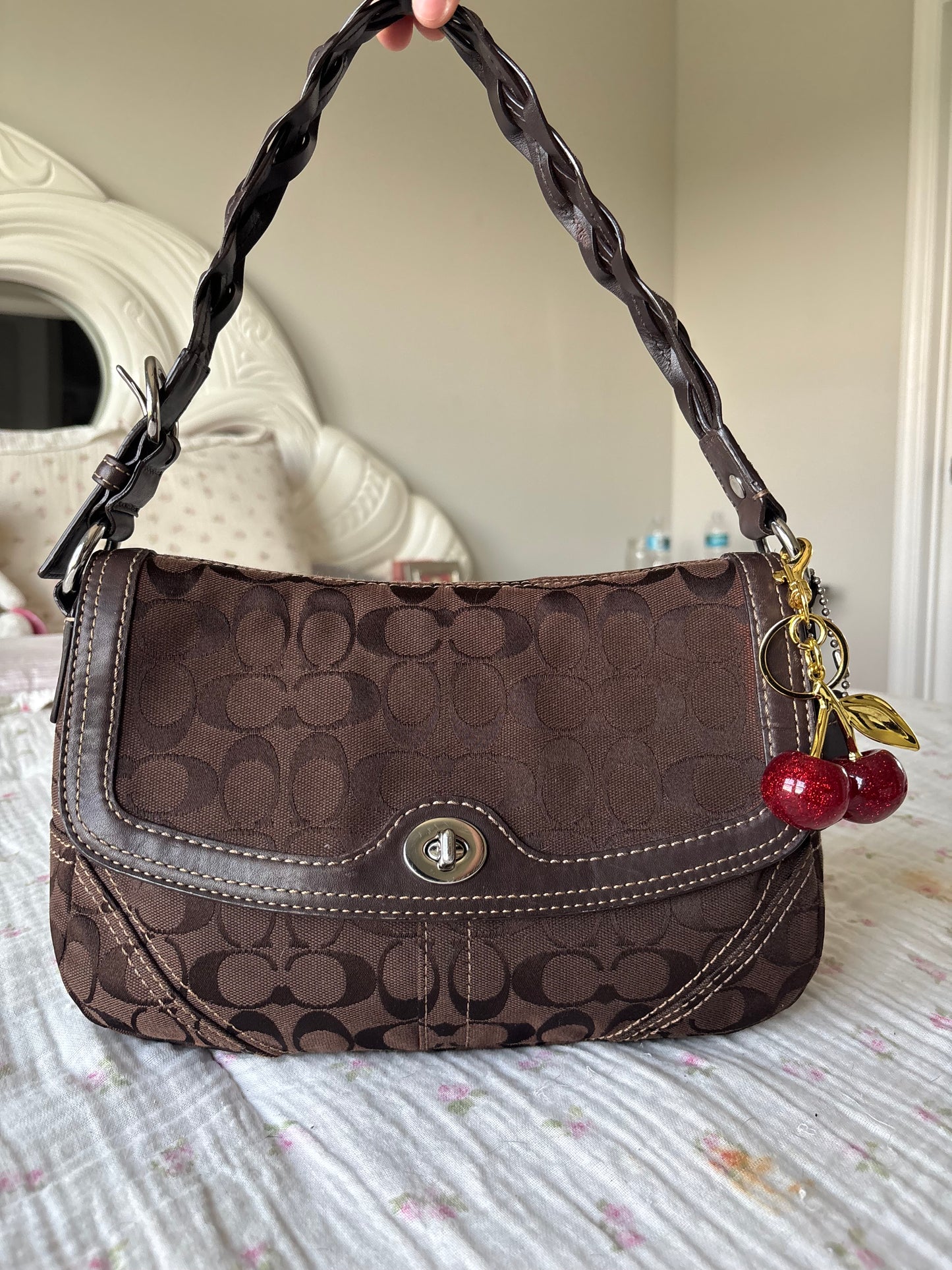 Brown mongram coach flap bag