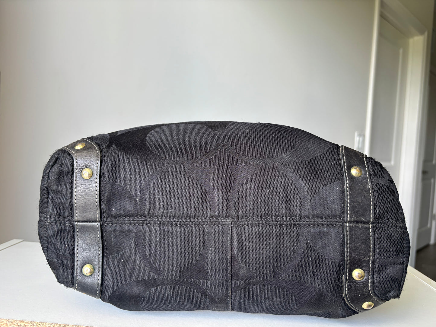 Black large coach Carly