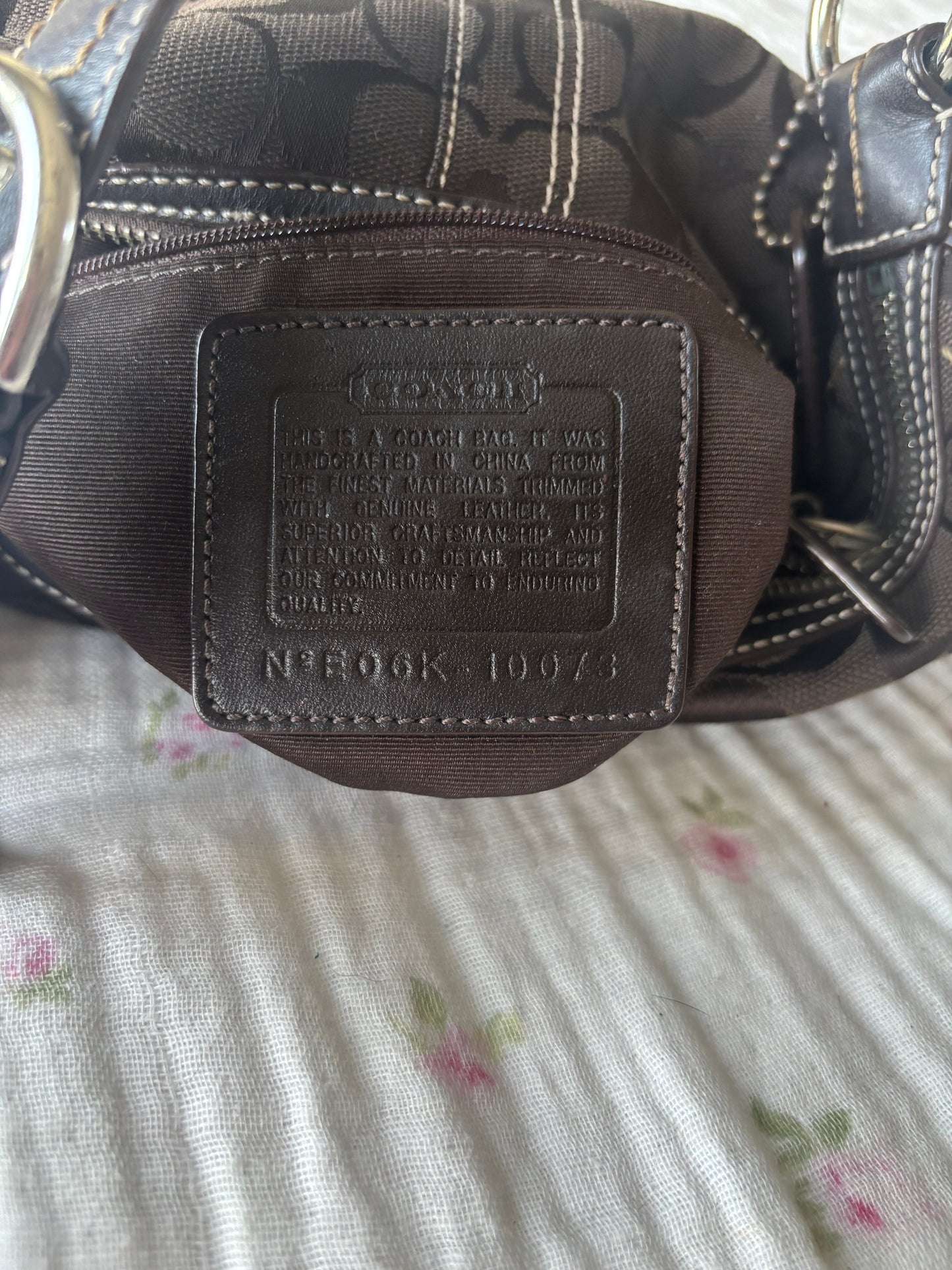 Brown mongram coach hobo bag