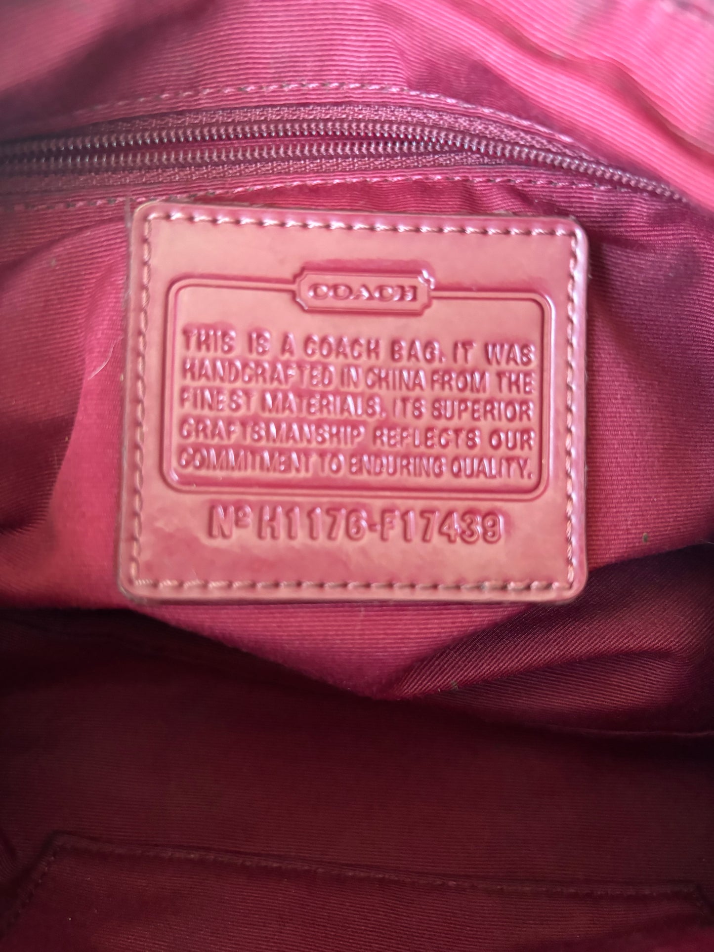 Red mongram coach shoulder bag